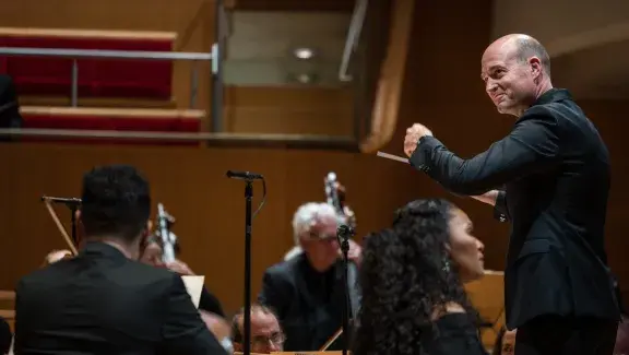 photo depicts Robert Istad conducting